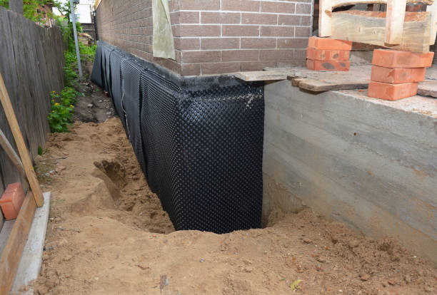 Happy homeowners after waterproofing job in Osceola